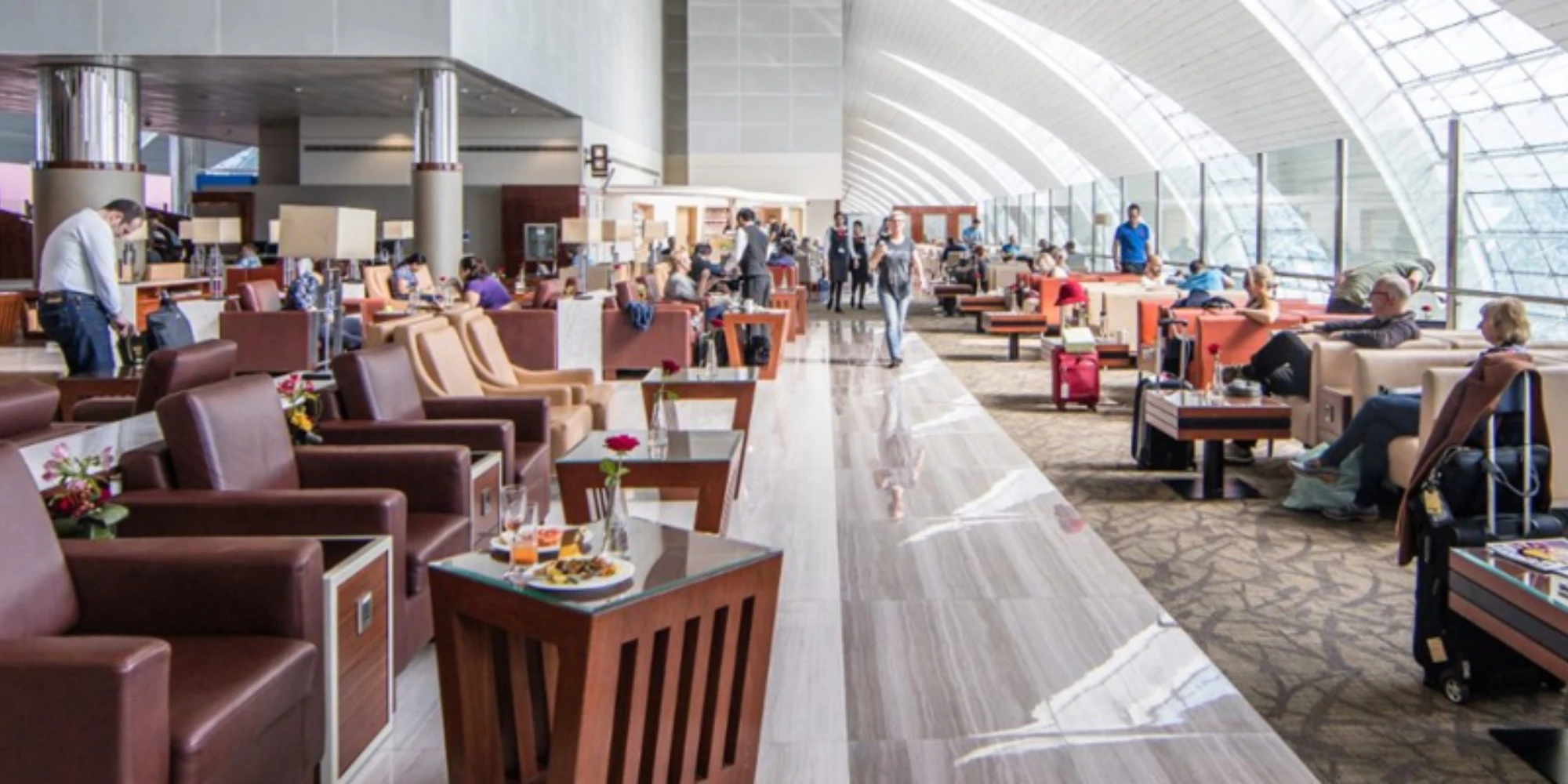 Emirates Business Class lounge with sweeping curved glass ceiling
